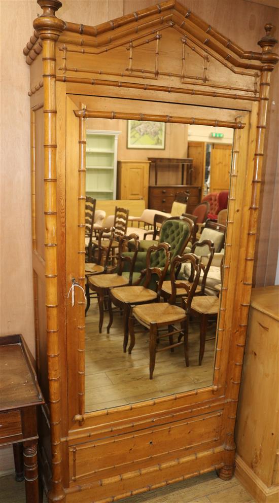 A faux bamboo mirrored cabinet with shelves W.100cm approx.